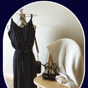 Navy blue jumpsuit with white and red stripes